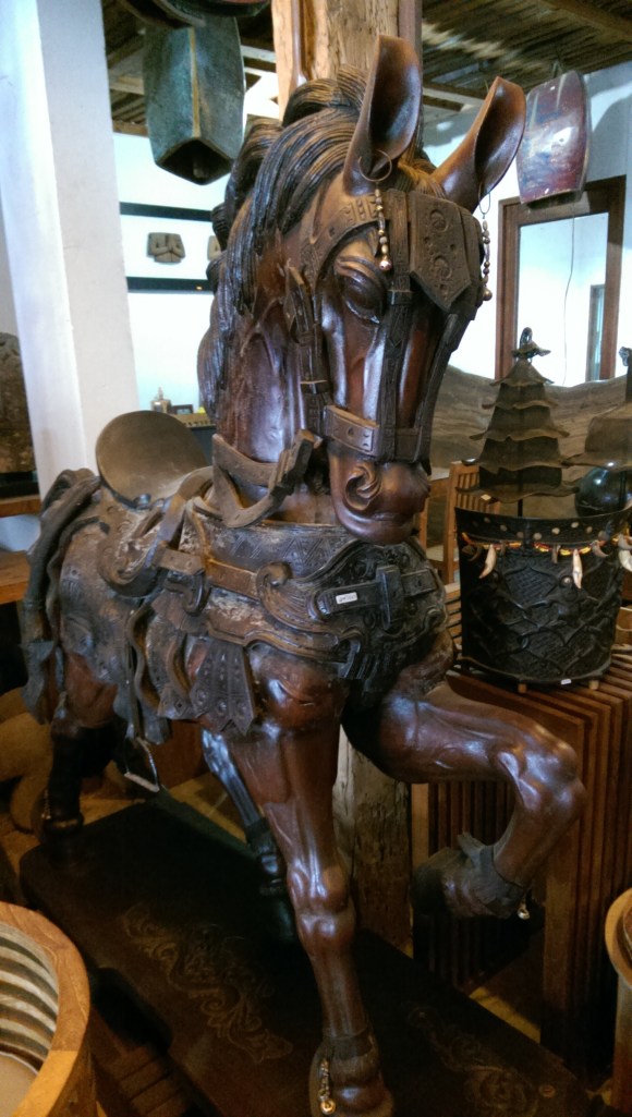 Life-size horse carving